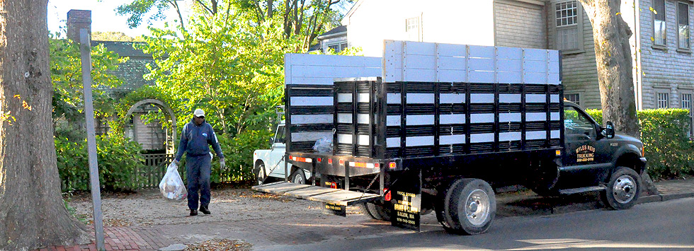 Reis Trucking packer truck making a residential pickup on Nantucket